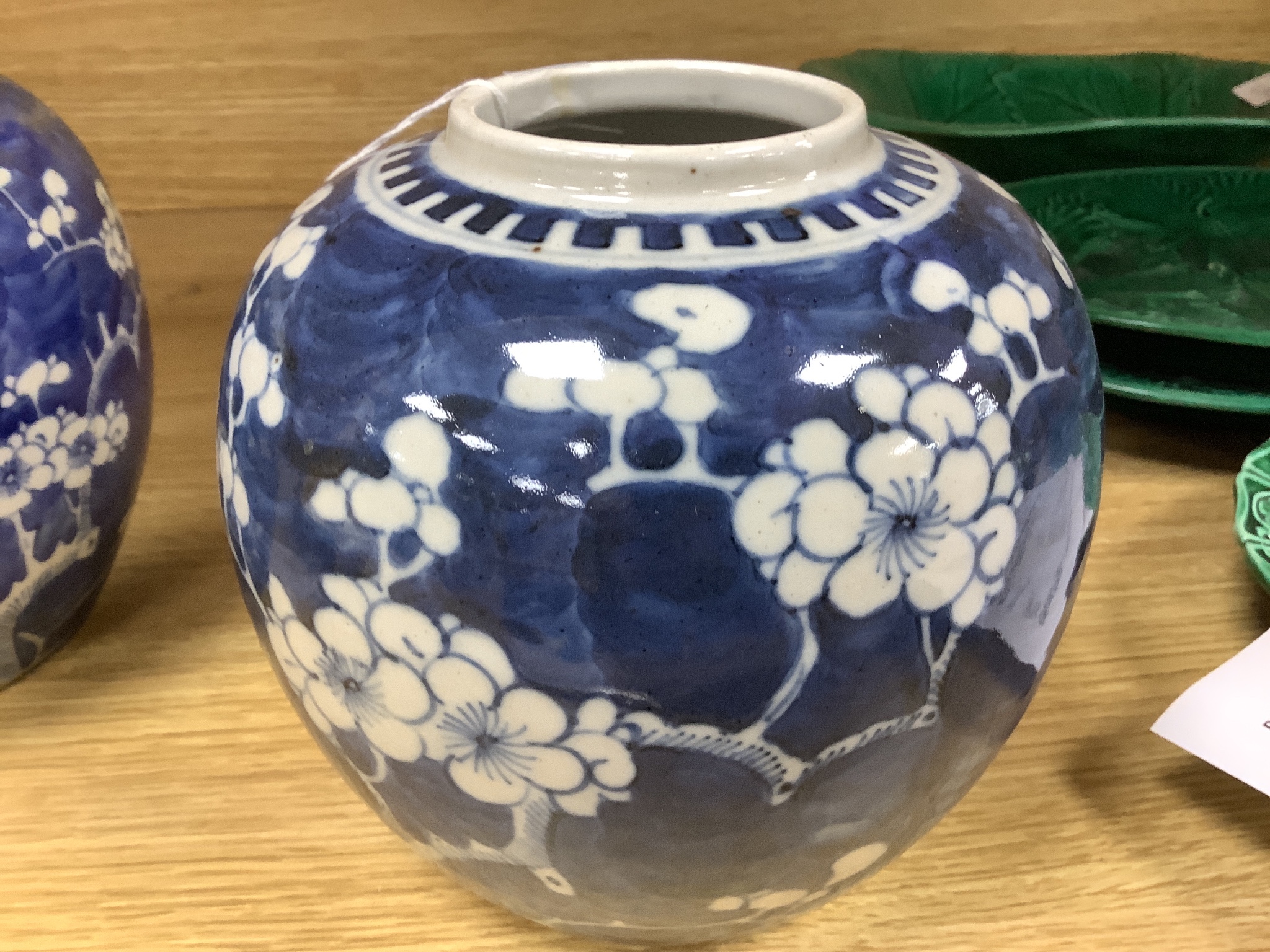 Two early 20th century Chinese blue and white prunus jars, tallest 16cm